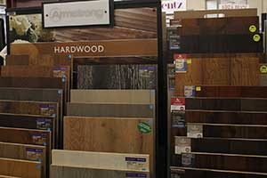 Hardwood floor samples of various colors in a sample rack