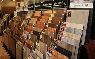 Laminate flooring samples of various colors in a sampe rack