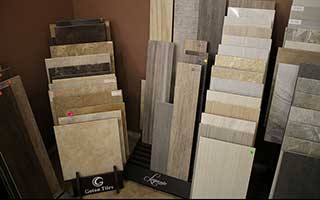 Tile flooring samples of various colors in 5 sample racks